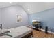 Bedroom featuring wood floors, a bed, a side table, and a television at 5904 River Lake Cir, Raleigh, NC 27604