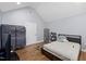 Bedroom featuring wood floors, a bed, and storage shelves at 5904 River Lake Cir, Raleigh, NC 27604