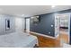 Bedroom featuring hardwood floors, a TV, and ample closet space at 5904 River Lake Cir, Raleigh, NC 27604