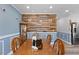 Elegant dining room with wood accents, a wooden dining table, and ample natural light at 5904 River Lake Cir, Raleigh, NC 27604