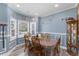 Inviting dining room with blue walls, white trim, and a wood dining set, perfect for Gathering gatherings at 5904 River Lake Cir, Raleigh, NC 27604