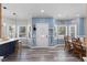 Bright entryway boasts hardwood floors and views of dining area at 5904 River Lake Cir, Raleigh, NC 27604