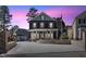 Stunning two-story home boasts inviting front porch and impeccable landscaping at 5904 River Lake Cir, Raleigh, NC 27604