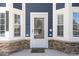 Welcoming front door with sidelights enhances the home's curb appeal at 5904 River Lake Cir, Raleigh, NC 27604