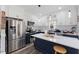 Bright kitchen with a large island, stainless steel appliances, and white cabinets providing ample storage at 5904 River Lake Cir, Raleigh, NC 27604