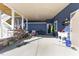 A covered patio with stone pillars and stairs leads to outdoor living space with ample room at 5904 River Lake Cir, Raleigh, NC 27604
