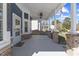 Inviting covered porch with ceiling fans offers a relaxing outdoor space at 5904 River Lake Cir, Raleigh, NC 27604