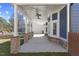 Spacious covered porch features ceiling fans and brick detailing at 5904 River Lake Cir, Raleigh, NC 27604