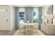 Stylish dining room featuring modern table, chairs, contemporary art, and elegant decor at 601 Morning Light Dr, Angier, NC 27501