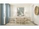 Bright dining room with modern table, chairs, contemporary art, and elegant decor at 601 Morning Light Dr, Angier, NC 27501