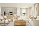 Open-concept living room with a modern sofa, kitchen island and neutral decor at 601 Morning Light Dr, Angier, NC 27501