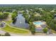Aerial view of the community highlighting a scenic lake and a beautiful pool area at 601 Walcott Way, Cary, NC 27519