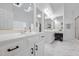 Bright bathroom featuring double sink vanity, white cabinetry and tiled flooring at 601 Walcott Way, Cary, NC 27519