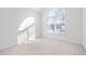 Bright bedroom with neutral carpet and large windows at 601 Walcott Way, Cary, NC 27519