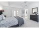 Bedroom featuring a comfortable bed, neutral decor, and ensuite bathroom access at 601 Walcott Way, Cary, NC 27519