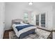 Cozy bedroom with french doors leading to a balcony, and a comfortable bed at 601 Walcott Way, Cary, NC 27519