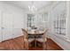 Charming dining area with natural light and a stylish chandelier at 601 Walcott Way, Cary, NC 27519