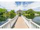 Picturesque gazebo on a serene lake, perfect for relaxation and enjoying waterfront views at 601 Walcott Way, Cary, NC 27519