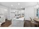 Modern kitchen with an island, quartz countertops, stainless appliances, and custom cabinets at 601 Walcott Way, Cary, NC 27519