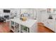 Stylish kitchen features a large island, modern finishes, and hardwood flooring at 601 Walcott Way, Cary, NC 27519