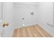 Laundry room featuring wood flooring and hookups at 601 Walcott Way, Cary, NC 27519