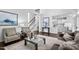Spacious living room with hardwood floors, staircase and access to the kitchen at 601 Walcott Way, Cary, NC 27519