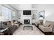 Living room with hardwood floors, fireplace, built-in shelves, and neutral decor at 601 Walcott Way, Cary, NC 27519