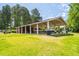 View of the community picnic shelter with picnic tables and green space at 601 Walcott Way, Cary, NC 27519