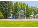 Community playground with various climbing structures and play equipment at 601 Walcott Way, Cary, NC 27519
