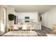 Open concept dining area with modern décor, stainless steel appliances, and a sunlit atmosphere at 712 Shea Hill Dr, Angier, NC 27501