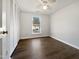 Bedroom features a window and closet with folding doors at 7271 Shellburne Dr, Raleigh, NC 27612