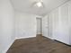 Bedroom features a ceiling fan and closet with folding doors at 7271 Shellburne Dr, Raleigh, NC 27612