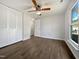 Bedroom featuring ceiling fan, view of ensuite, and large closet at 7271 Shellburne Dr, Raleigh, NC 27612