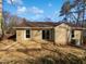 View of the back of the home with deck and sliding glass doors at 7271 Shellburne Dr, Raleigh, NC 27612