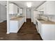 Well-lit kitchen featuring ample cabinetry and appliances at 7271 Shellburne Dr, Raleigh, NC 27612