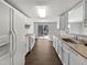 Bright kitchen featuring ample counter space and a view of the backyard at 7271 Shellburne Dr, Raleigh, NC 27612
