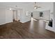 Bright living room with hardwood floors, fireplace, and seamless flow to other areas at 7271 Shellburne Dr, Raleigh, NC 27612