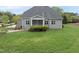 Well-manicured backyard featuring a patio and an outdoor porch at 1005 Keith Rd, Wake Forest, NC 27587