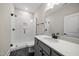 Bathroom featuring a walk-in shower with white subway tile and a modern vanity at 1005 Keith Rd, Wake Forest, NC 27587