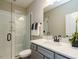 Well-lit bathroom with a glass shower, a modern vanity, and neutral accents at 1005 Keith Rd, Wake Forest, NC 27587