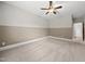 Bedroom with neutral carpet, two-tone paint, and a ceiling fan at 1005 Keith Rd, Wake Forest, NC 27587