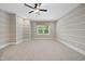 Bedroom with carpet, custom wall trim, and a window with blinds at 1005 Keith Rd, Wake Forest, NC 27587