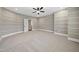 Bedroom with carpet, custom wall trim, and an open doorway at 1005 Keith Rd, Wake Forest, NC 27587