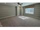 Bright bedroom with a ceiling fan, neutral carpet, and a window that allows for ample natural light at 1005 Keith Rd, Wake Forest, NC 27587