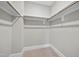 An empty walk-in closet with wooden racks for storage, ready to be filled at 1005 Keith Rd, Wake Forest, NC 27587