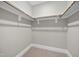 Walk-in closet featuring wooden racks and shelving for efficient storage solutions at 1005 Keith Rd, Wake Forest, NC 27587