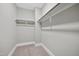 Walk-in closet with carpeted floor and hanging rods at 1005 Keith Rd, Wake Forest, NC 27587