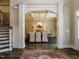 Elegant dining room with a coffered ceiling, chandelier, and view to the entry hall at 1005 Keith Rd, Wake Forest, NC 27587