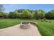 A brick fire pit adds charm to the backyard's outdoor living space at 1005 Keith Rd, Wake Forest, NC 27587