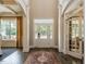 Grand foyer with high ceilings, elegant hardwood floors, and abundant natural light at 1005 Keith Rd, Wake Forest, NC 27587